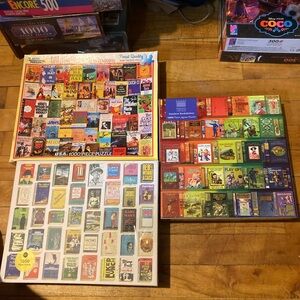 3x 1000 Pieces Puzzles. Classic Paperbacks, Rainbow bookshelves & Bestsellers.